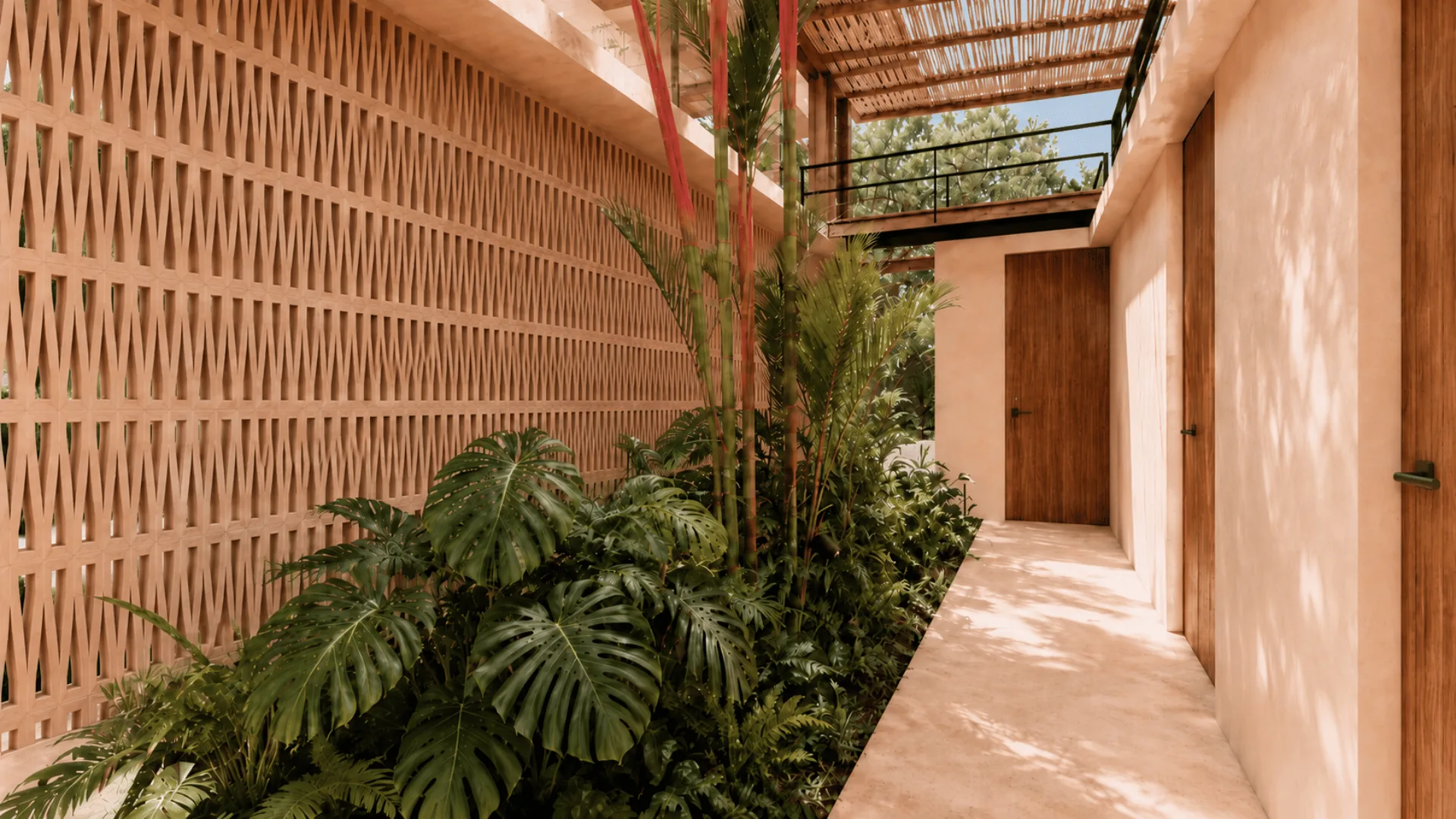 Jardín Eterno entry walkway beside a breeze block wall and planting